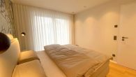 3-Zimmer-Wohnung, Terrasse, eigener Garten, Küche, voll möbliert, Einzel-Garage - Schlafzimmer.jpg
